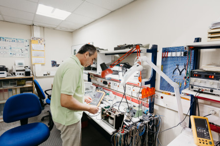 A person working in the electronics workshop